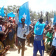 Somali residents raise flags.